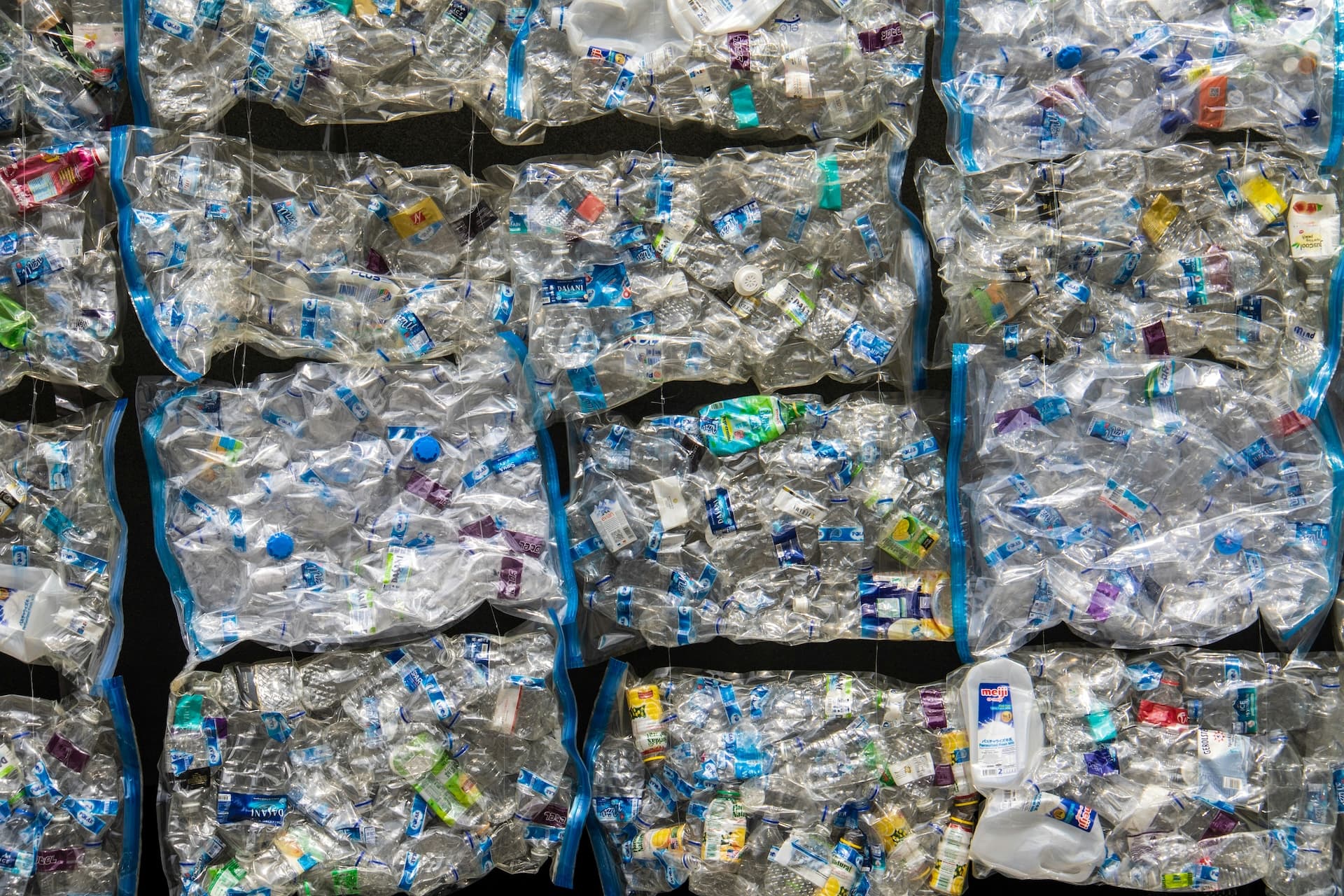 Wall of Used Plastics in Singapore (📷: Nick Fewings, Unsplash)